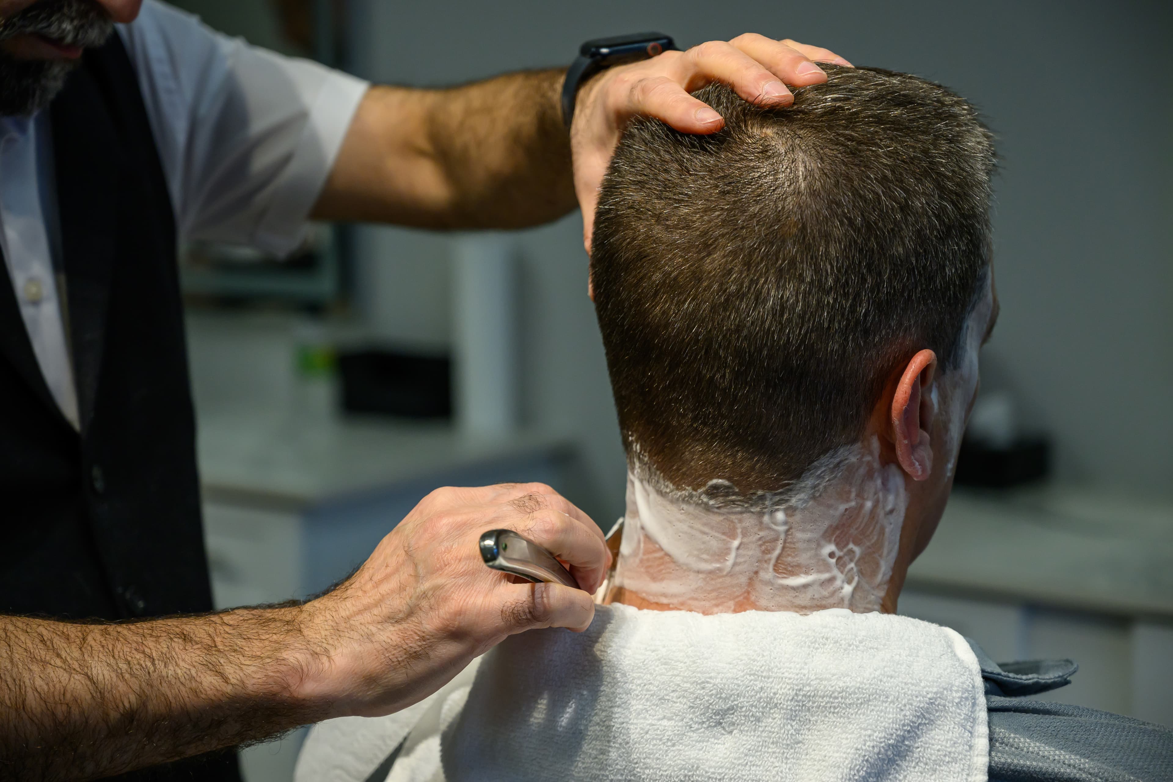 Hot towel shave detail at Family Barbershop