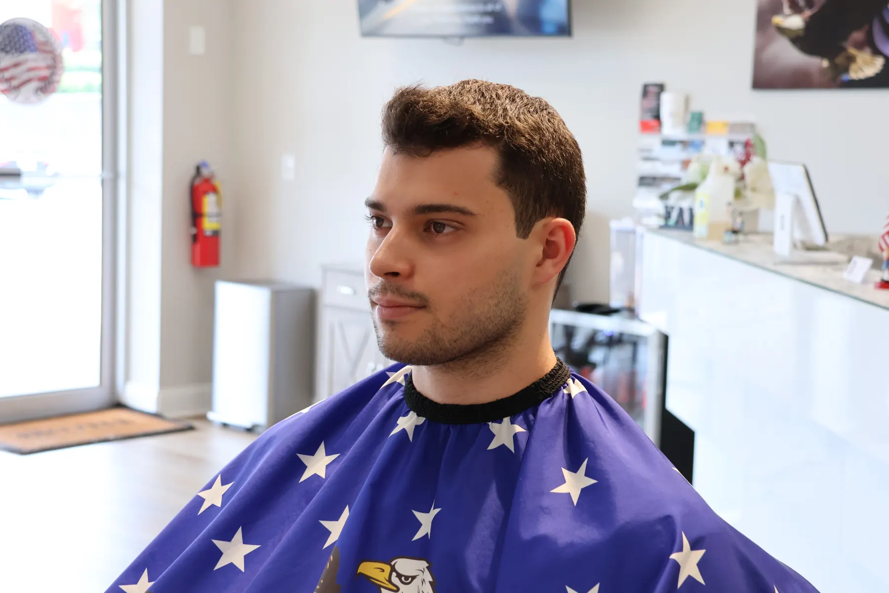 Customer in the chair by the front windows